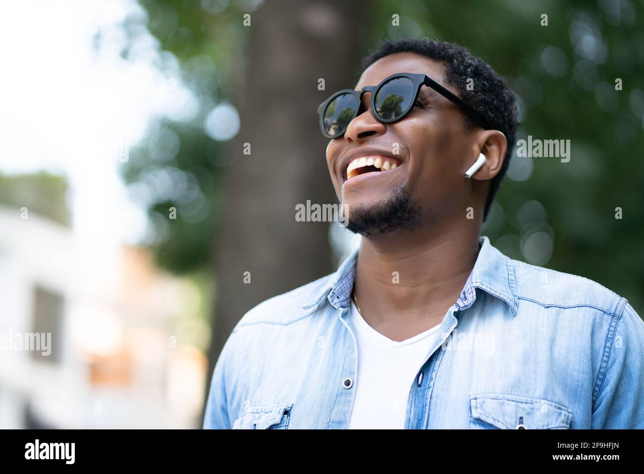 Happy african american man walking hi-res stock photography and images ...