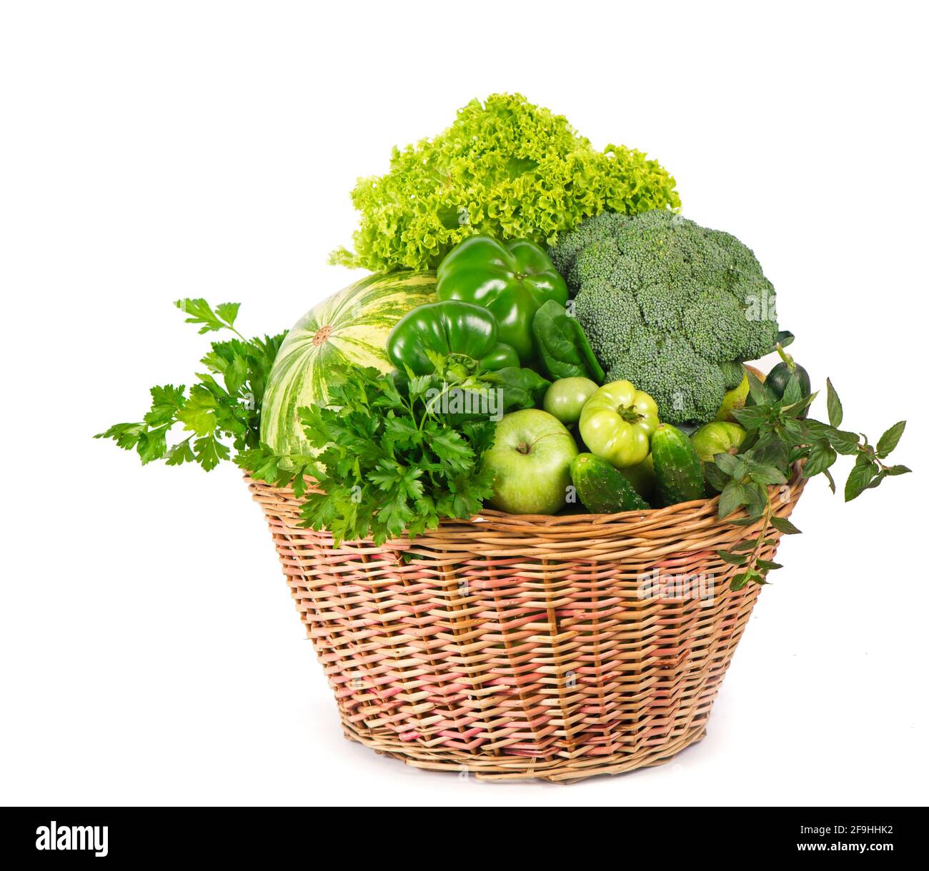 Fresh green vegetables in a wicker basket Stock Photo - Alamy