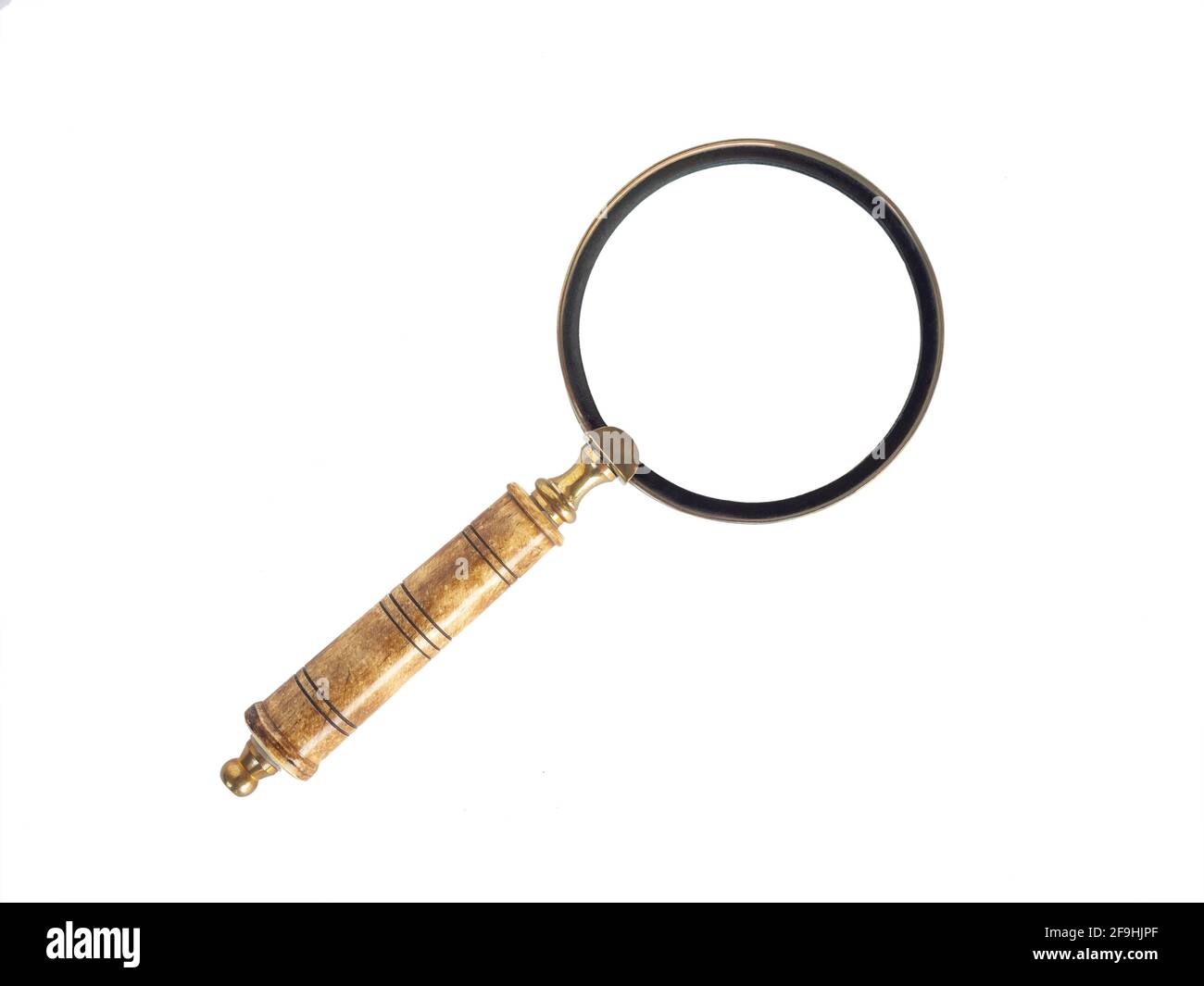 Old vintage magnifying glass isolated on white background. Ancient