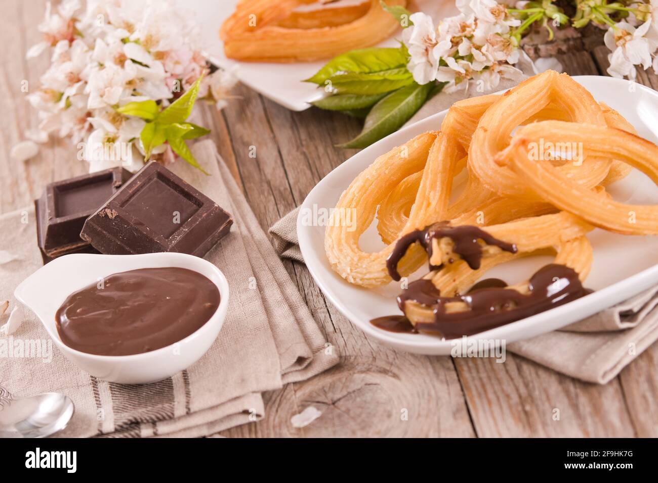 Churros With Chocolate Dipping Sauce Stock Photo - Alamy