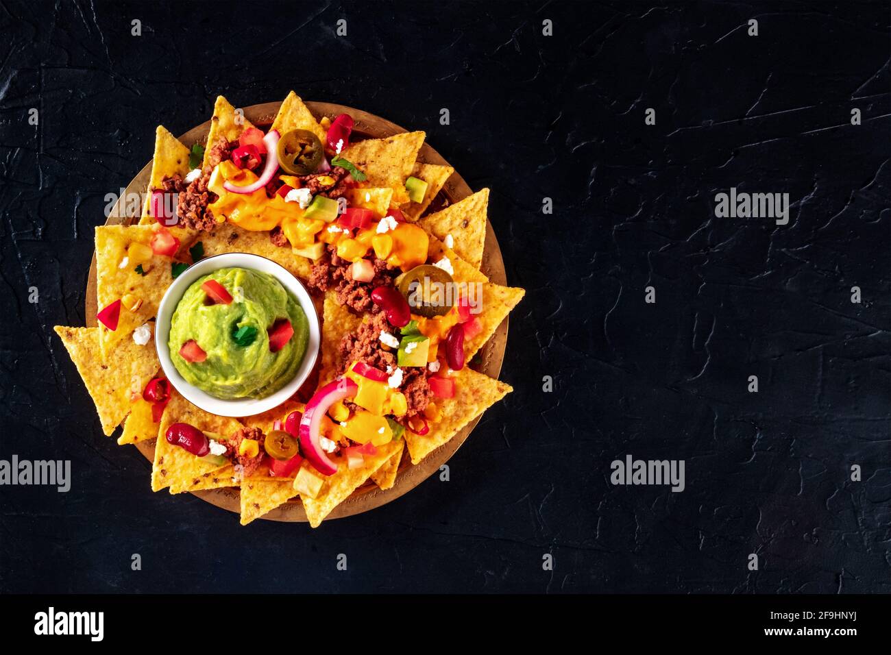 Mexican nacho chips with meat and guacamole Stock Photo Alamy