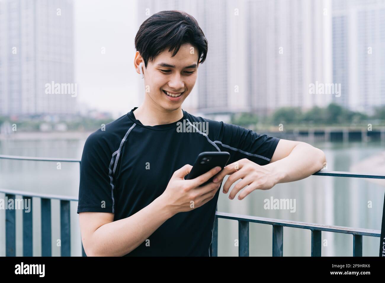 Young Asian man is resting after the practice session Stock Photo
