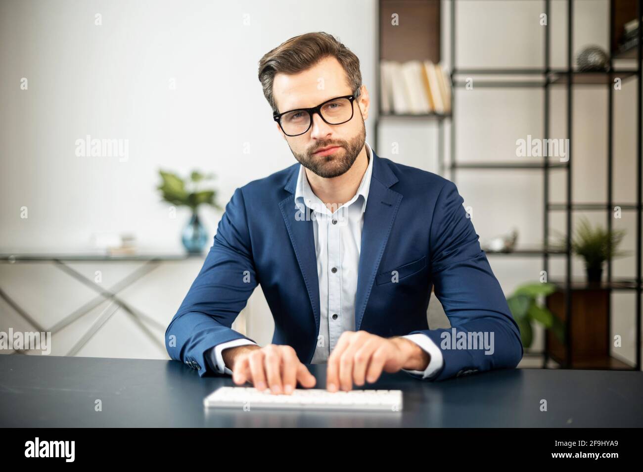 Serious big boss working on hi-res stock photography and images - Alamy