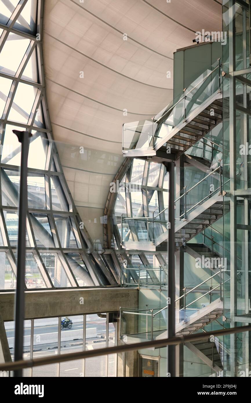 Samut Prakan / Thailand - 03/21/2021: Glass, metal and white fabric exterior of Suvarnabhumi Airport, serving as international airport for Bangkok, Th Stock Photo