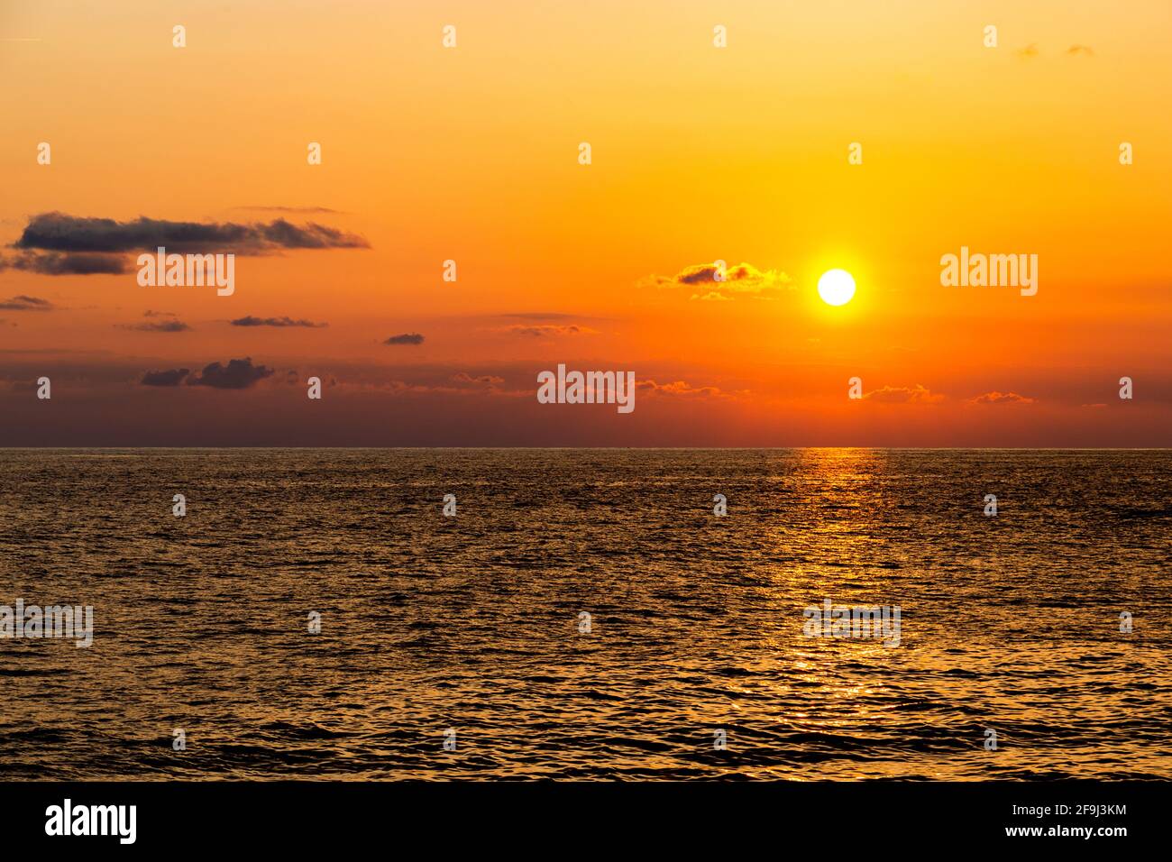 Sunset over sea. Dramatic sky. Stock Photo