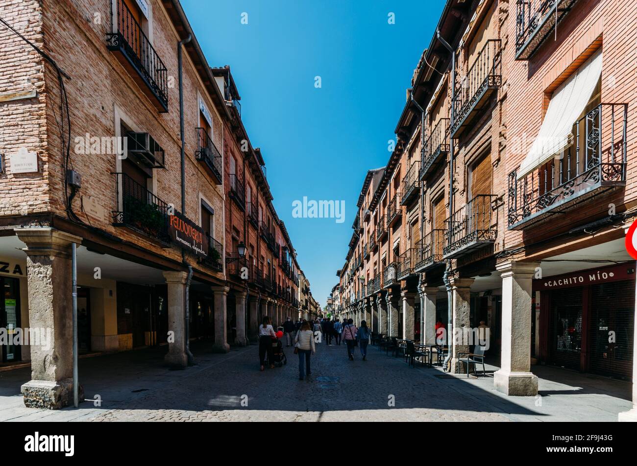 Main street (Calle Mayor) with curious buildings, street cafes and people Stock Photo