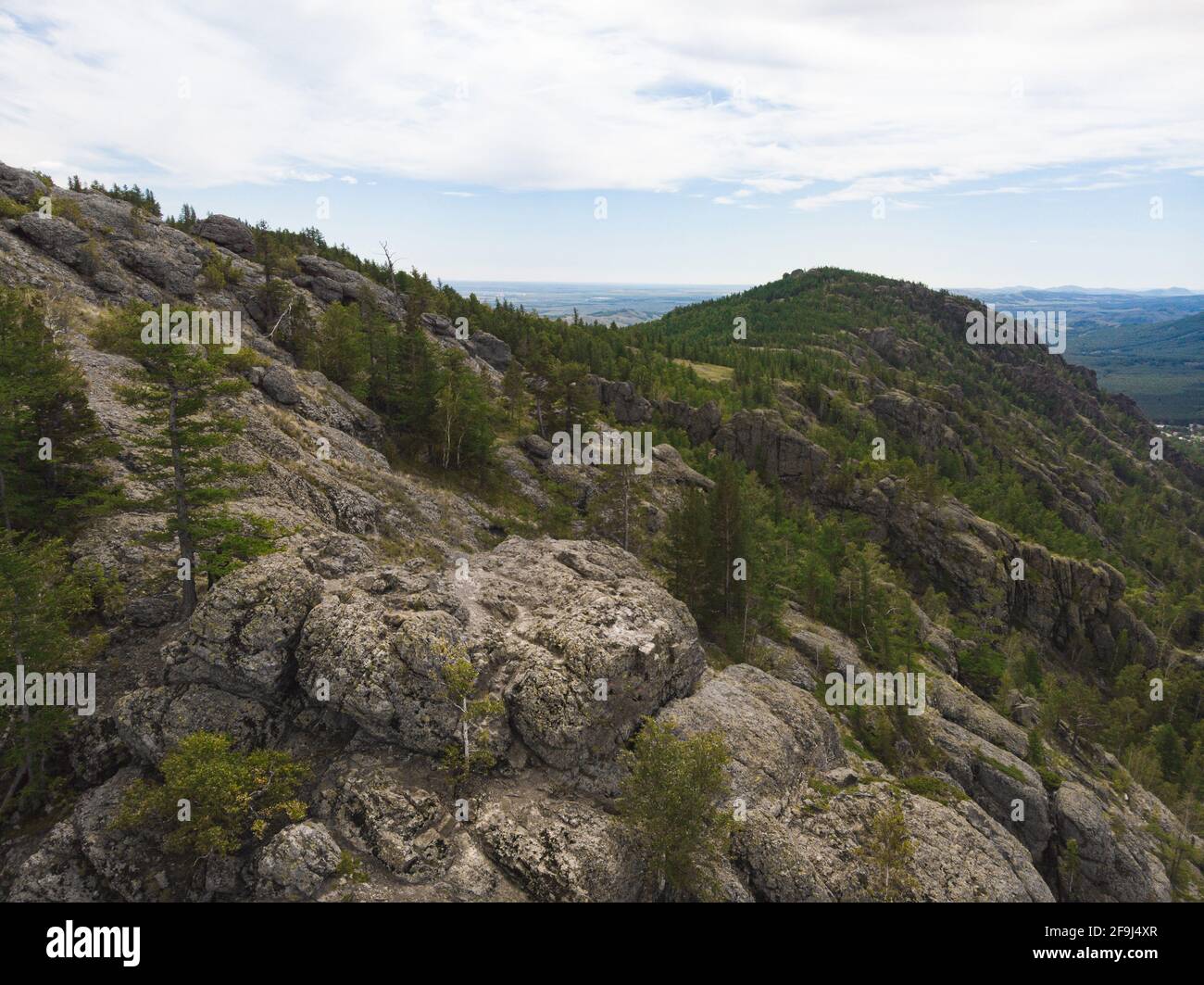 evergreen fir forest on a hilltop among the mountains of the National Park of the Republic of Bashkortostan on Lake Bannoye Stock Photo
