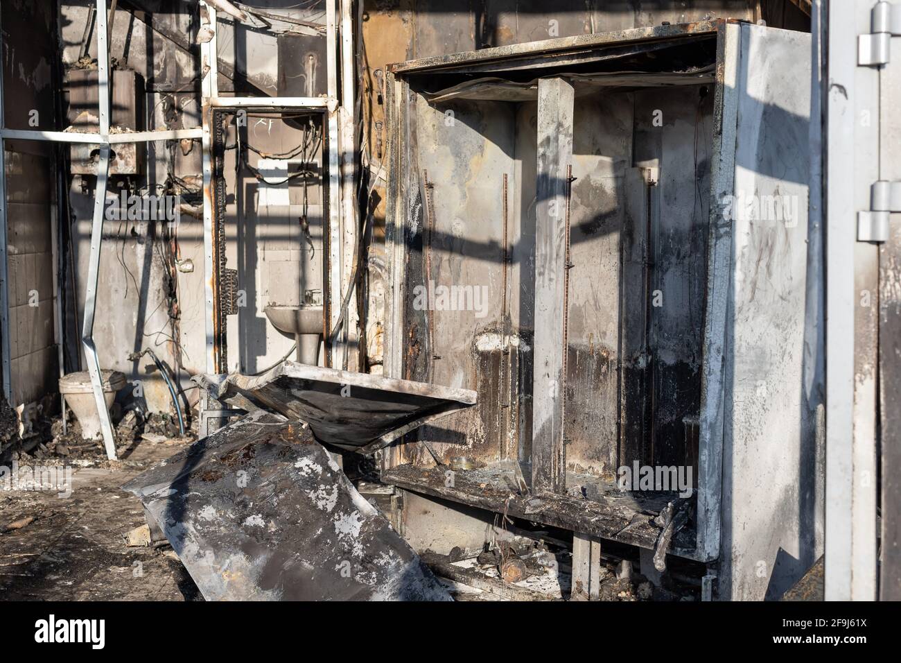 burnt refrigerator in supermarket after intense fire burning