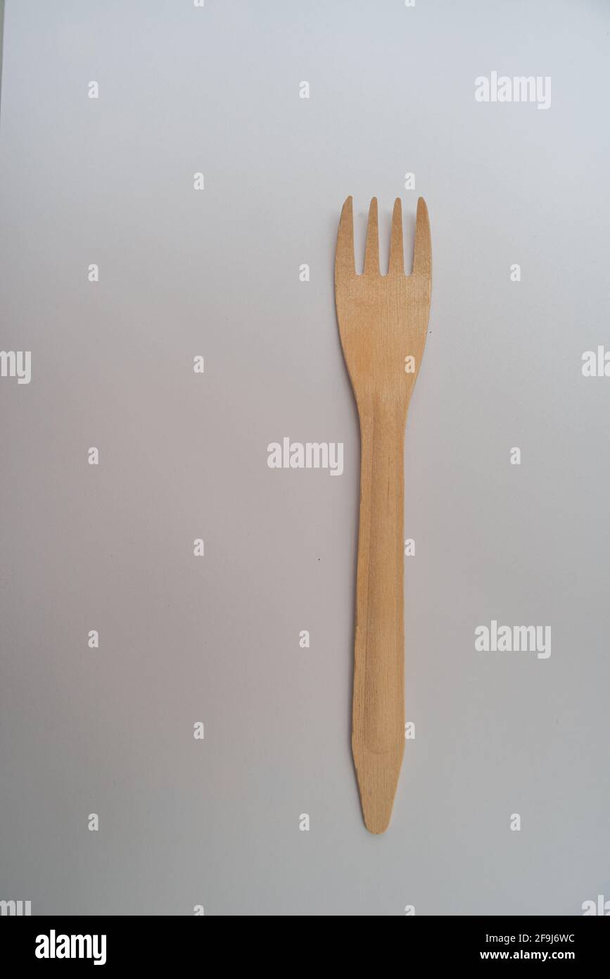 wooden disposable fork  ,eco freindly cutlery . On white background . Stock Photo