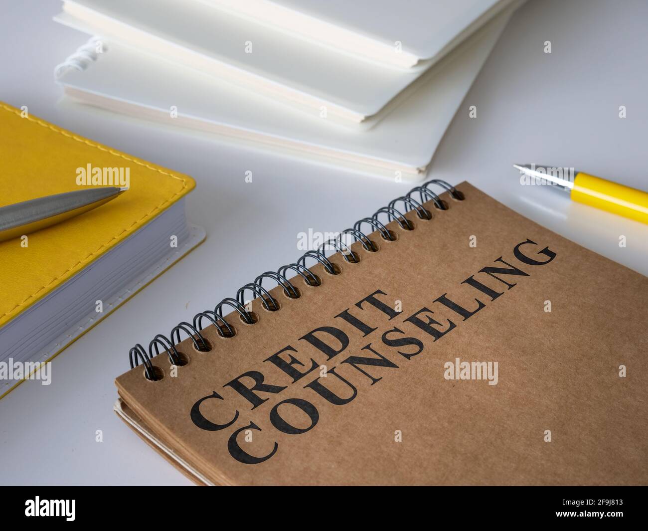 Credit counseling notepad on the white desk. Stock Photo