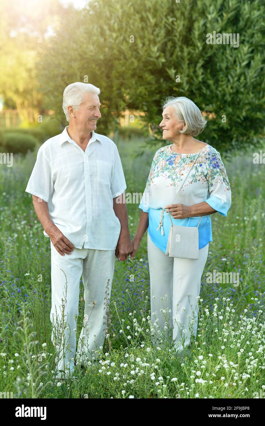 Beautiful happy senior couple in the park Stock Photo - Alamy