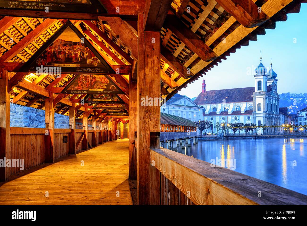 Historical Chapel Bridge, decorated with medieval paintings dating back to the 1630-s years (public domain), is the oldest wooden covered bridge in Eu Stock Photo