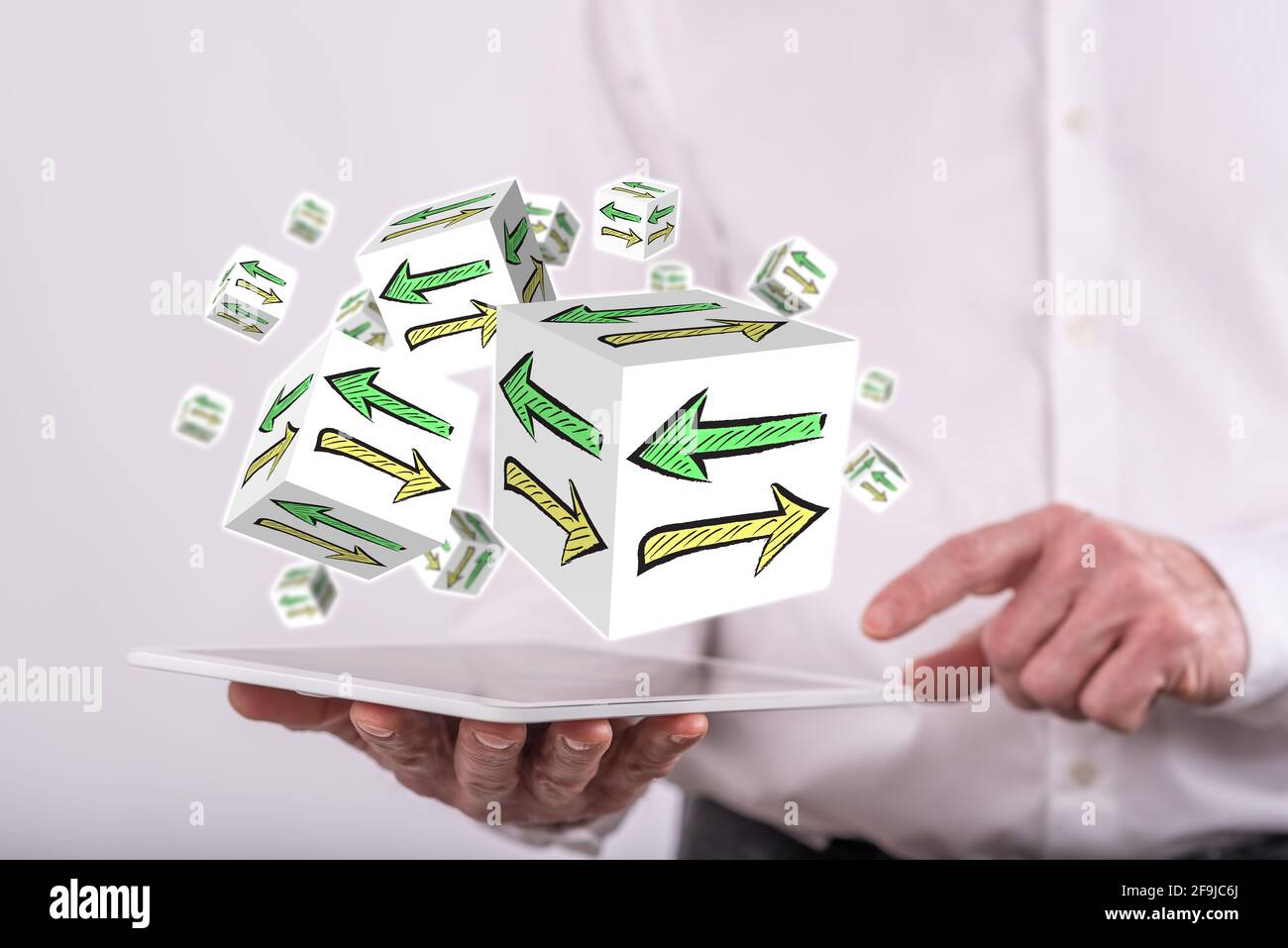 Decision concept above a tablet held by a man in background Stock Photo