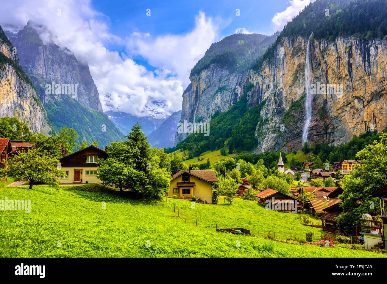 Lauterbrunnen village, famous for its historical architecture, many waterfalls and spectacular setting in an Alps mountains valley, Bernese Highlands, Stock Photo