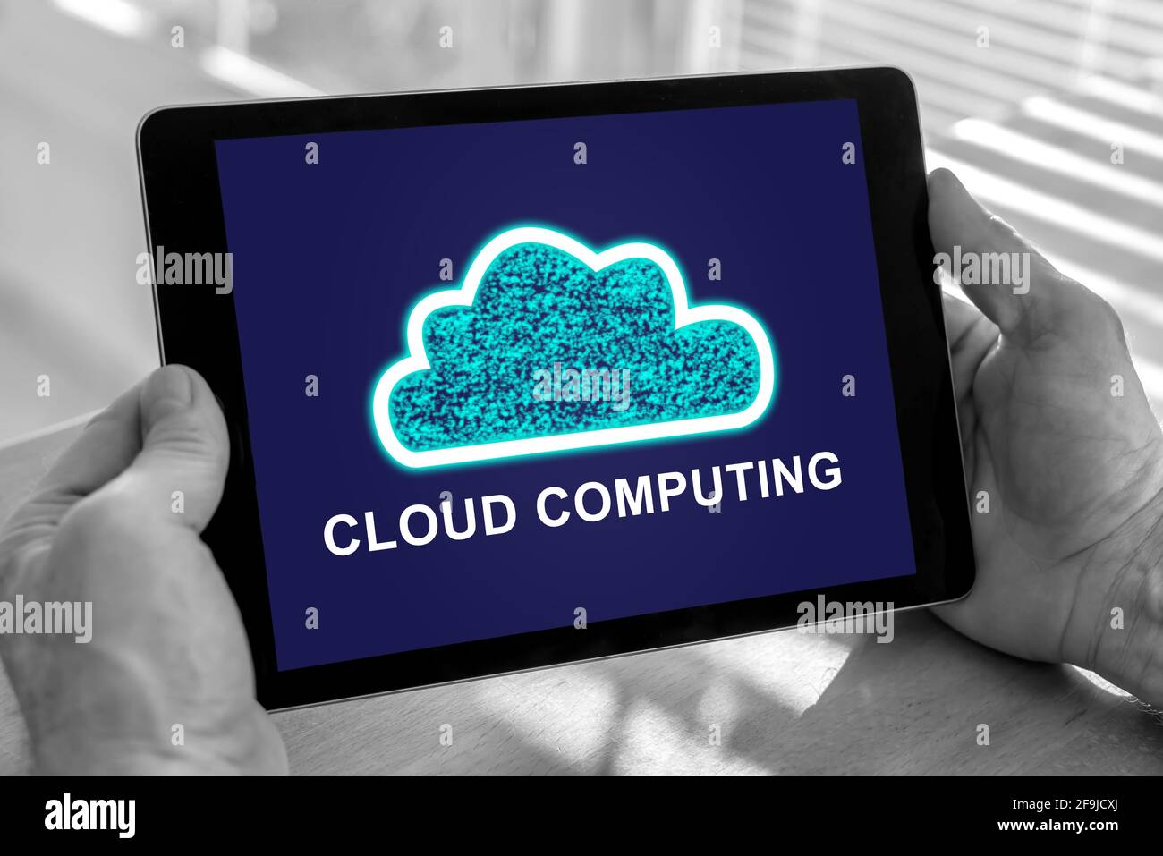 Male hands holding a tablet with cloud computing concept Stock Photo ...
