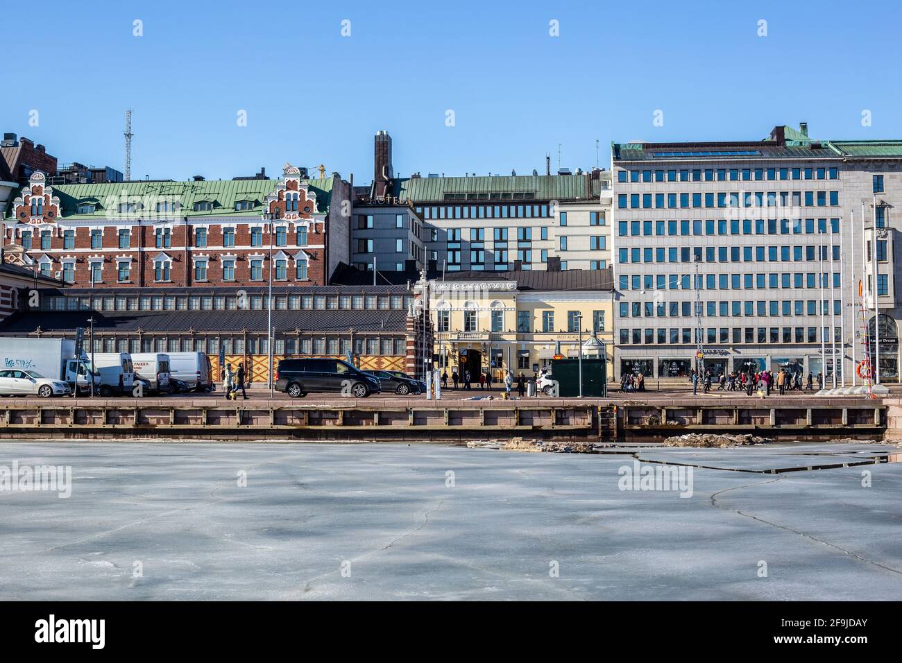 Helsinki, Finland - March 11, 2017: View of Colorful Buildings in the South Harbour on a Sunny Day Stock Photo