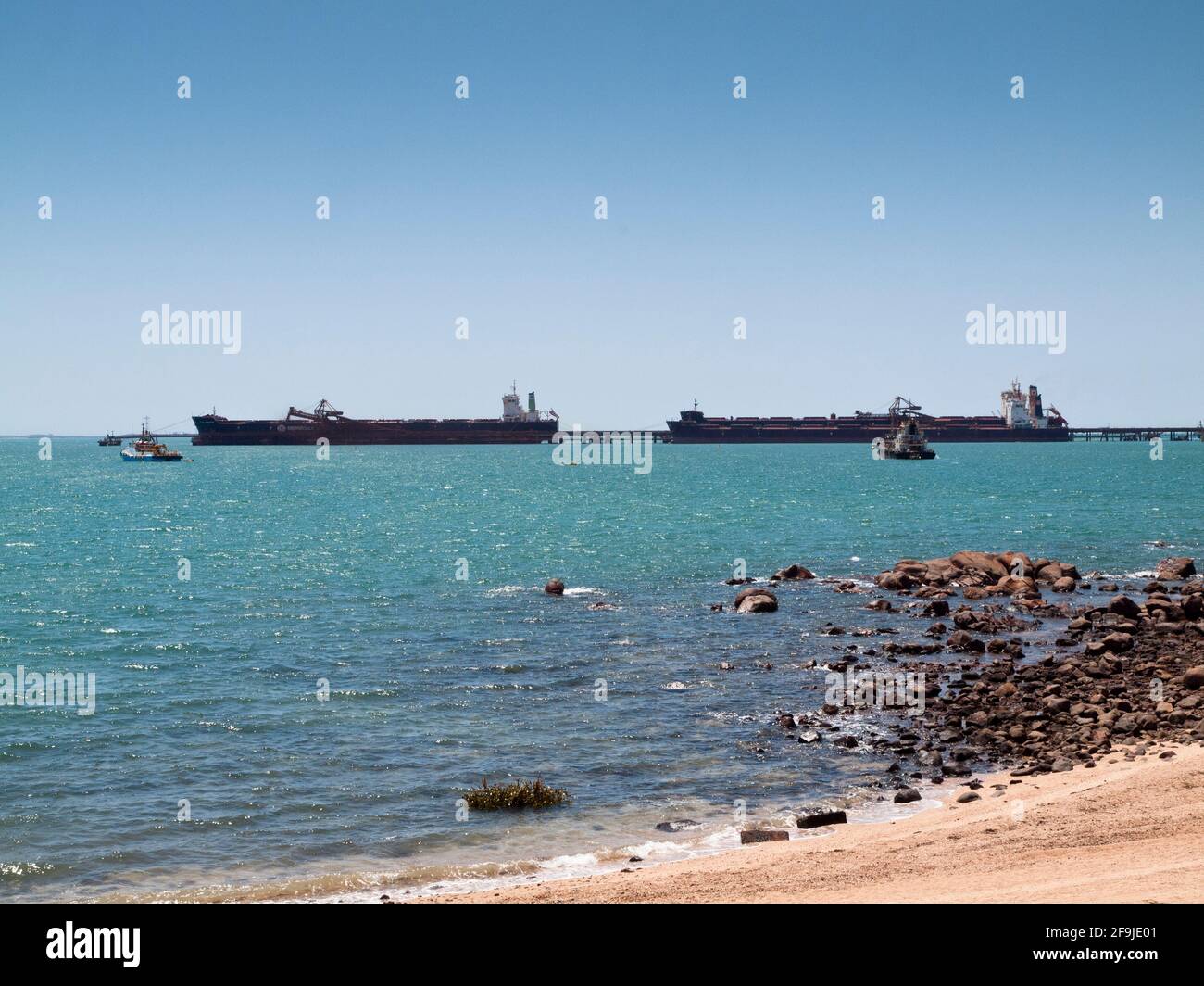 Bulk carrier ships loading iron ore at Parker Point, Dampier Western Australia. Stock Photo