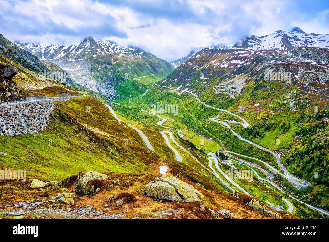 Furka road bends to the high mountain Furka pass in the swiss Alps, Switzerland Stock Photo