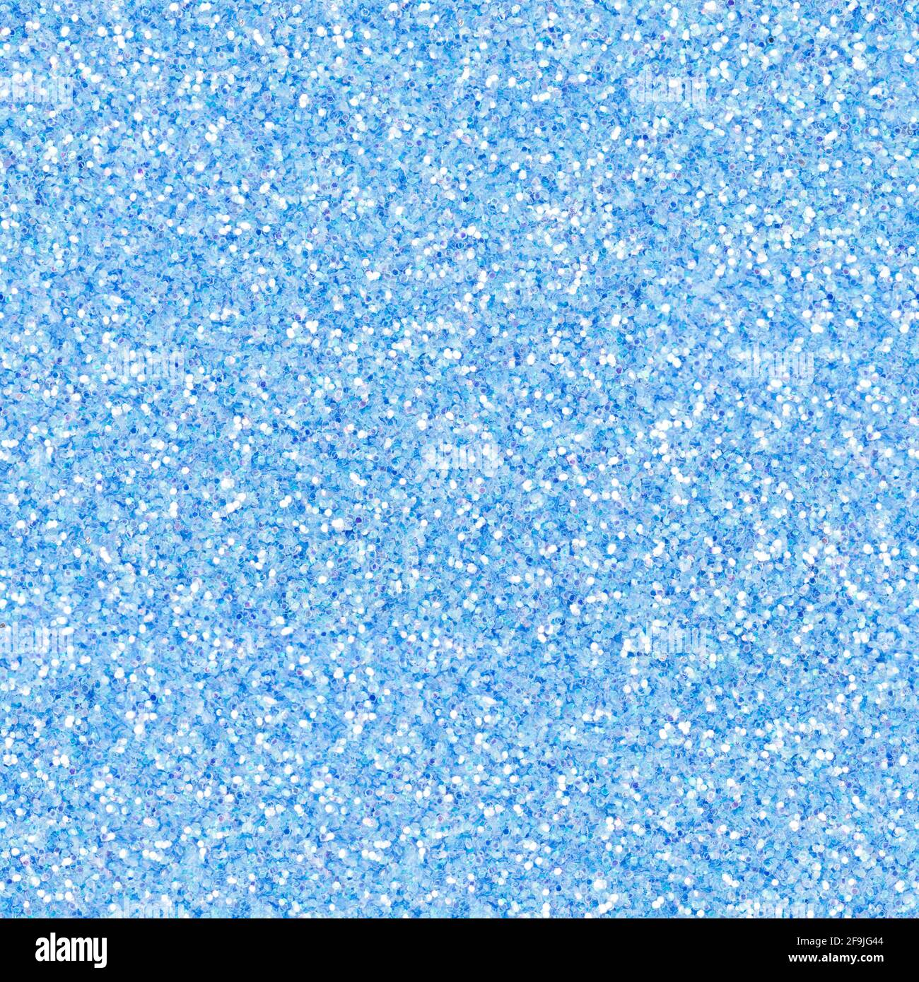 Bright light blue glitter, sparkle confetti texture. Christmas abstract background, seamless pattern. Stock Photo