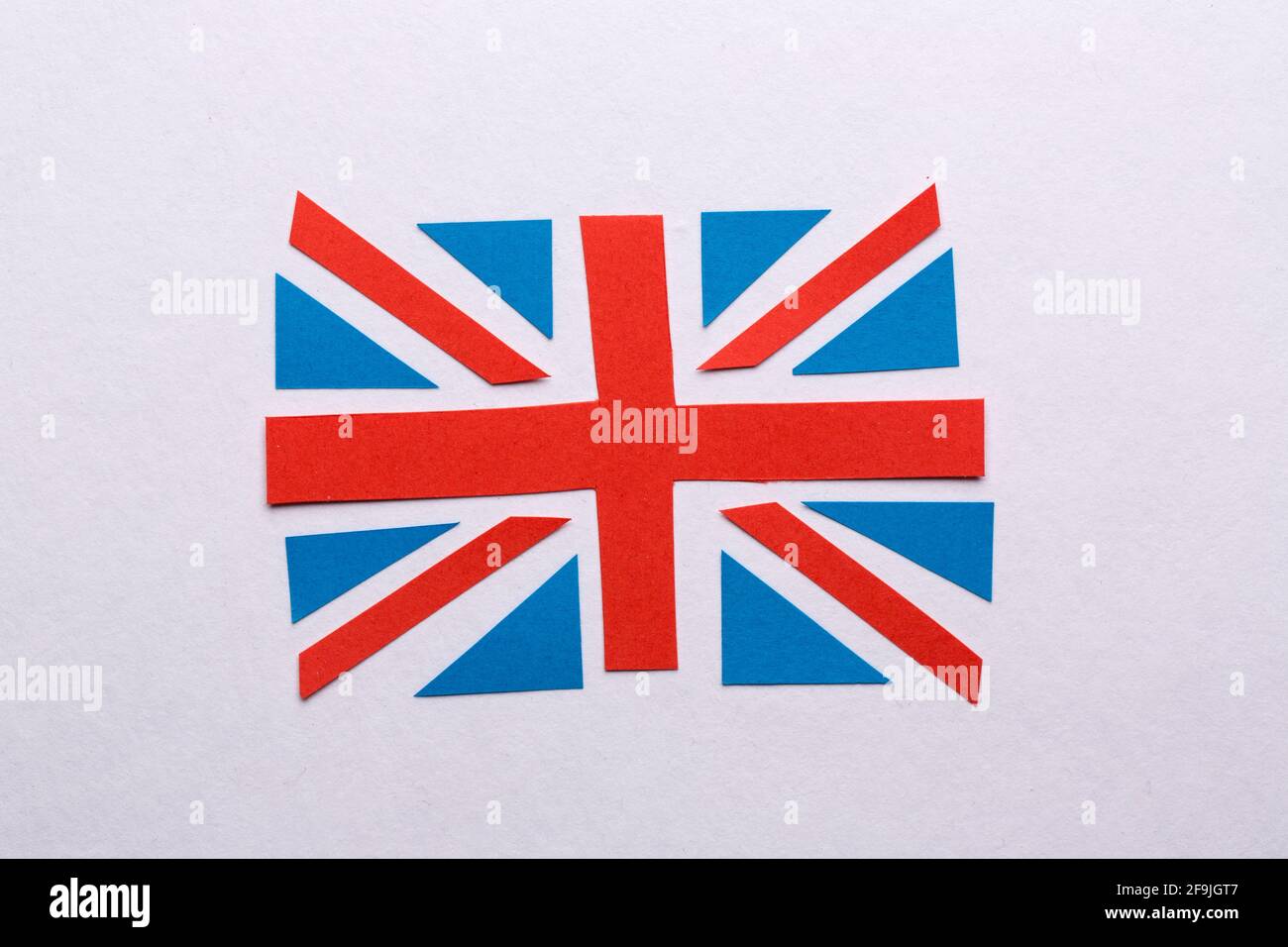 The flag of Great Britain cut out from the blue and red paper. Stock Photo
