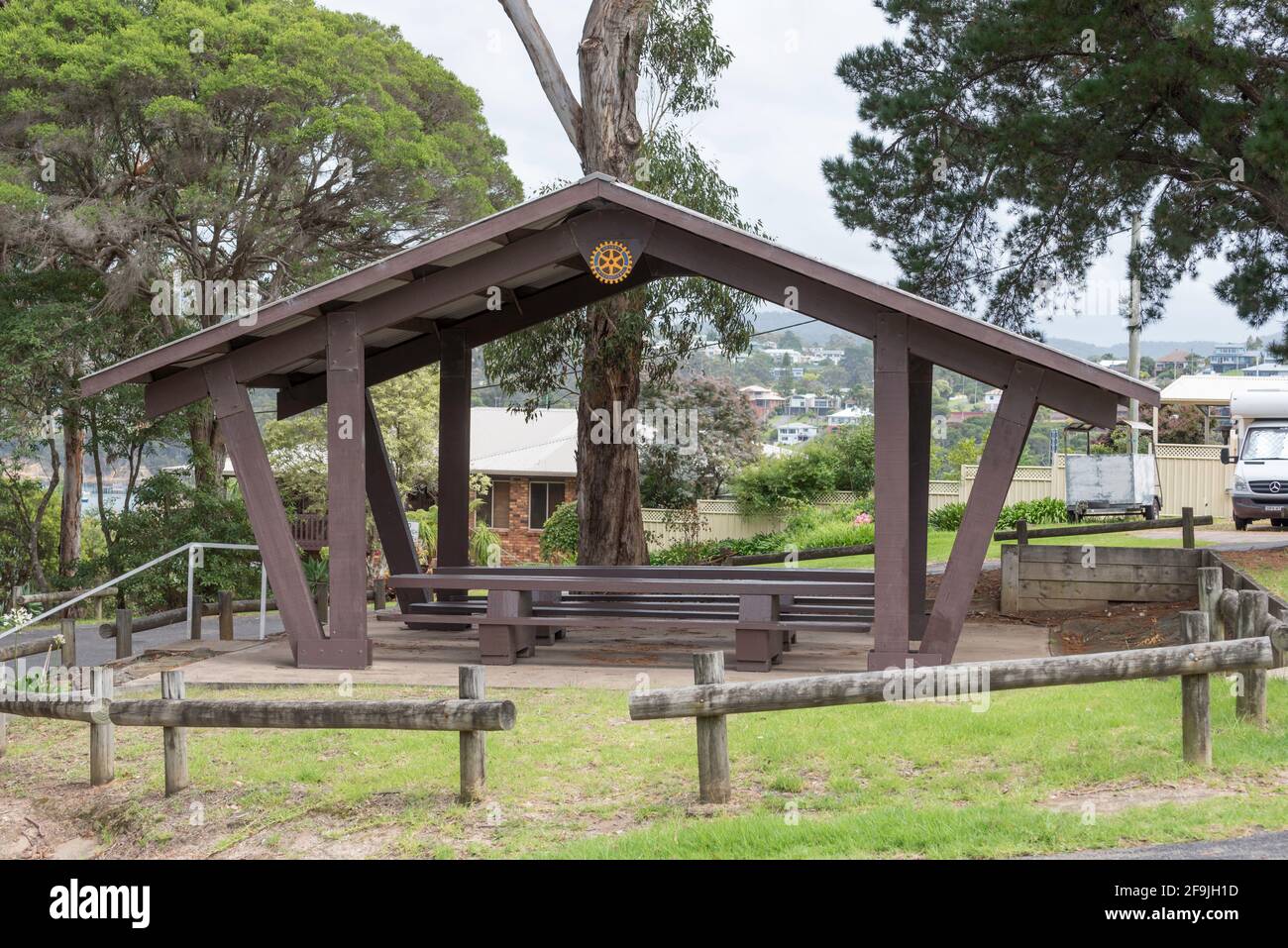 A large outdoor picnic table setting in a public park at Rotary Park in
