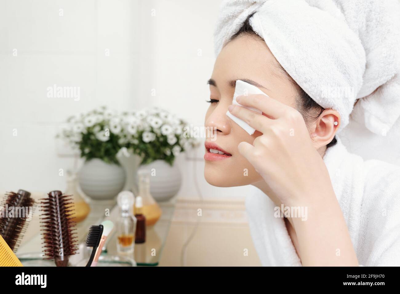Young woman applying micellar hi-res stock photography and images - Alamy