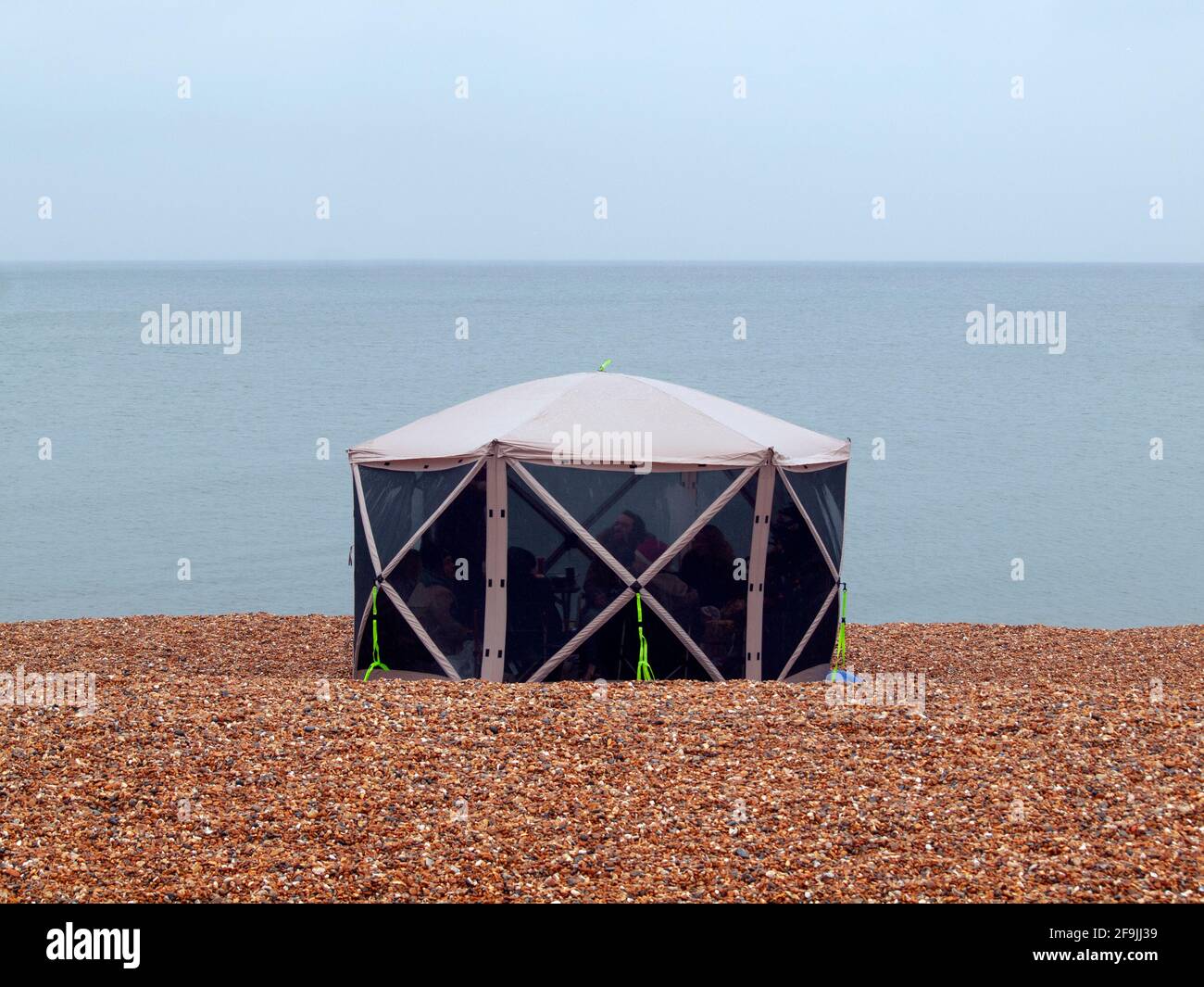 A strange tent on the beach at Brighton Stock Photo Alamy