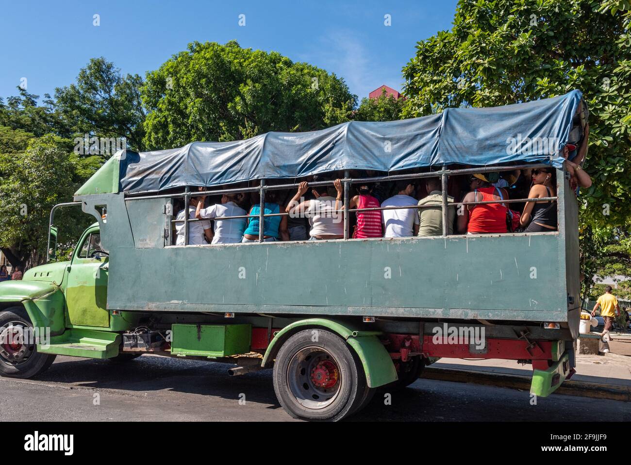 Urban passenger transportation using vintage American truck, Santiago de Cuba, Cuba Stock Photo