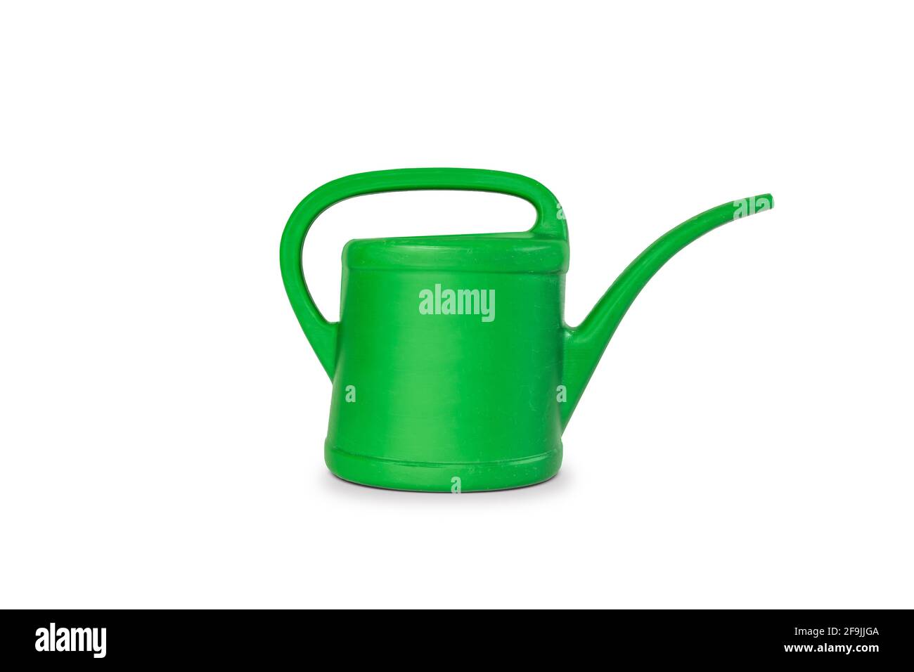 Green watering can on white. Stock Photo