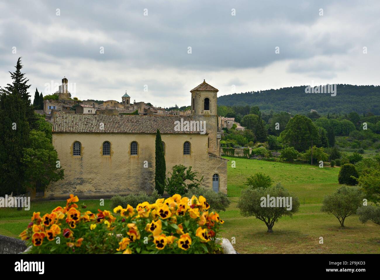 Landscape with scenic view of the Protestant Temple a landmark in the countryside of Lourmarin, Vaucluse Provence, France. Stock Photo