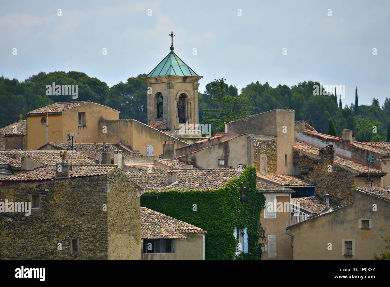 Landscape with  Provençal style clay tile rooftop houses in the picturesque village of Lourmarin in Vaucluse, Provence France. Stock Photo