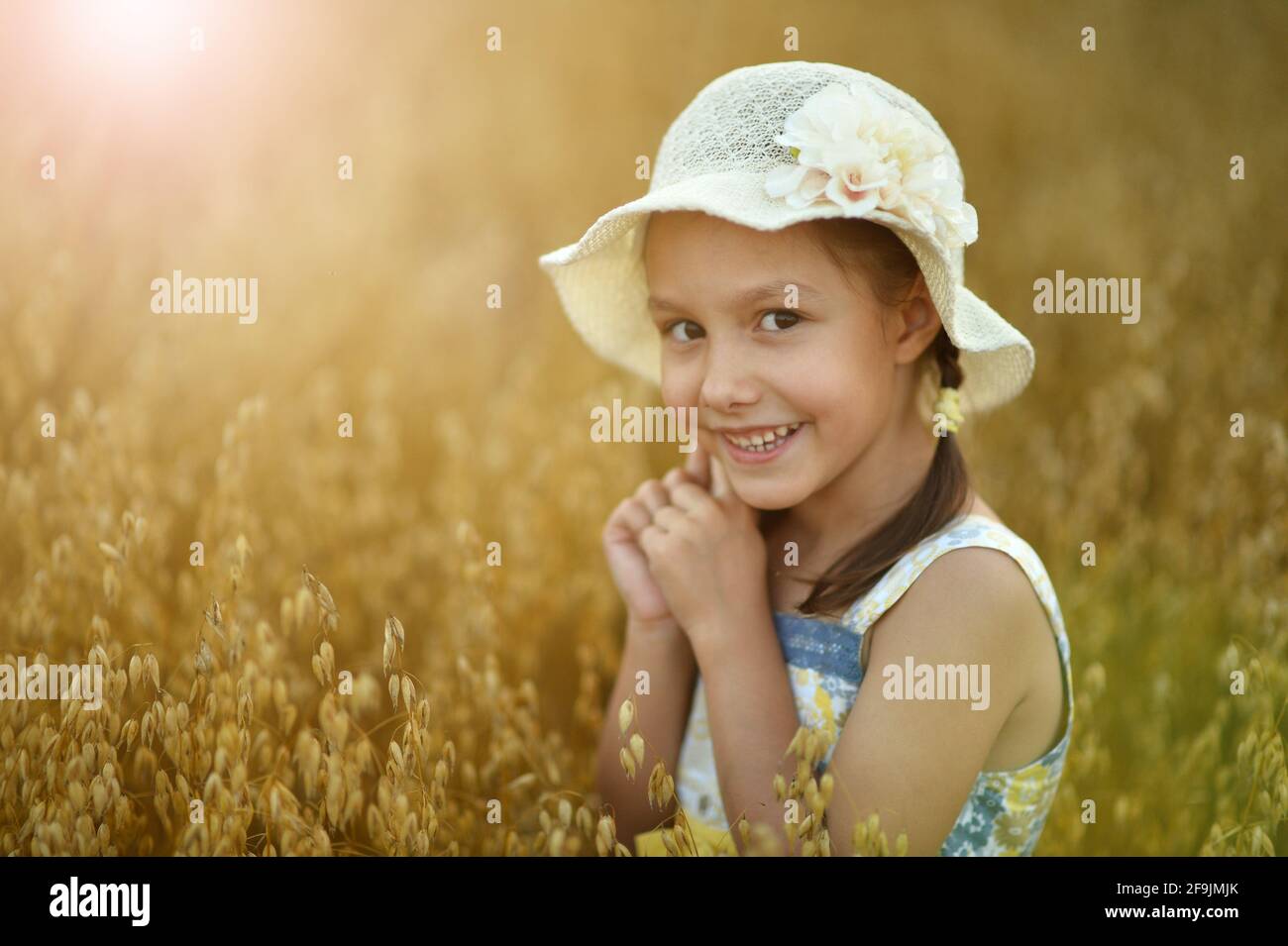 Portrait of cute little girl in wheat field Stock Photo - Alamy