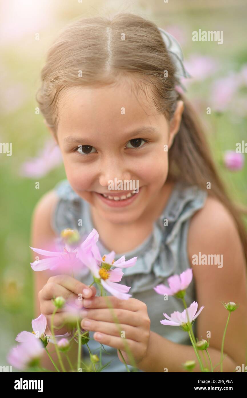 Portrait of cute little girl in park Stock Photo - Alamy
