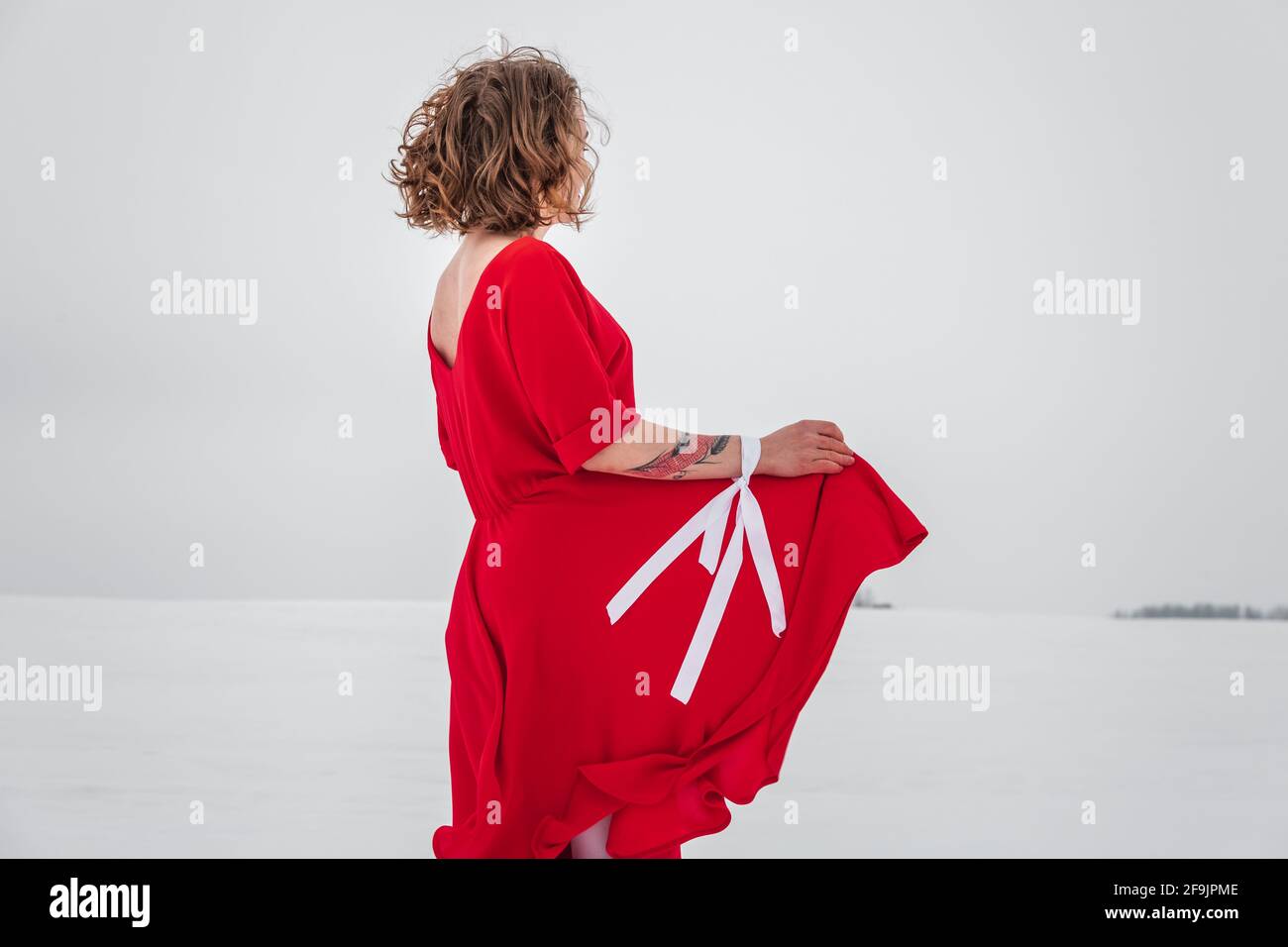 Beautiful woman in a red dress Stock Photo - Alamy