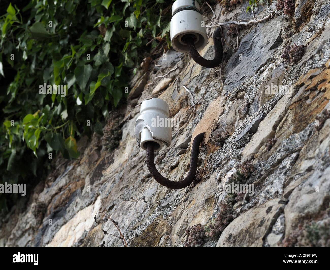 old ceramic telephone cable wire support detail Stock Photo - Alamy