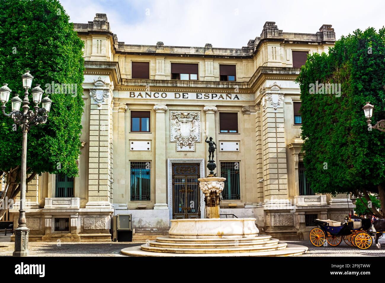 Seville, Andalusia, Spain - May 12, 2013: The building of the Bank of Spain with the mercury fountain in the square of St. Francis. Stock Photo