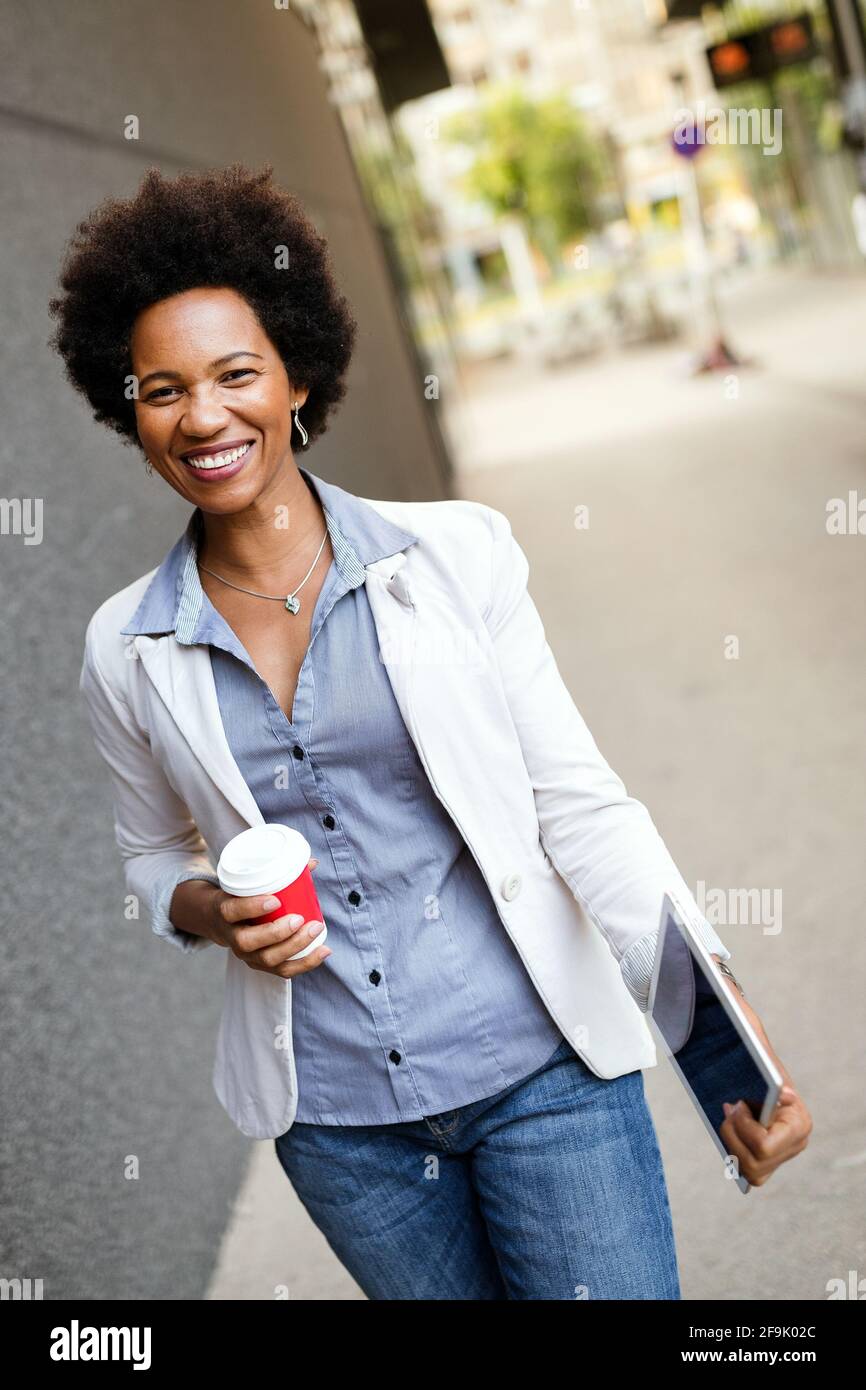 African woman walking hi-res stock photography and images - Alamy
