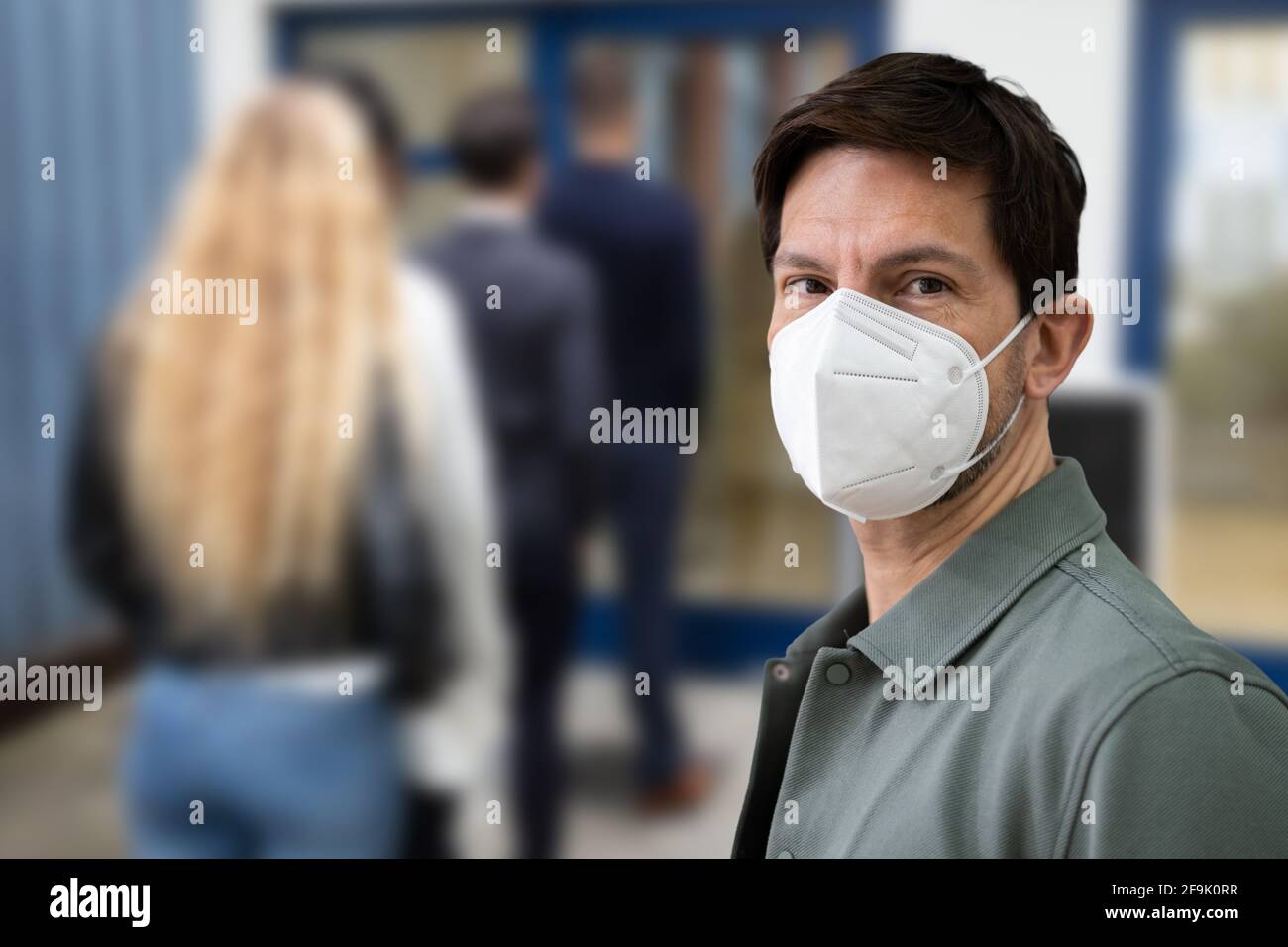 Unemployed Line Or Queue In Covid Face Mask Stock Photo