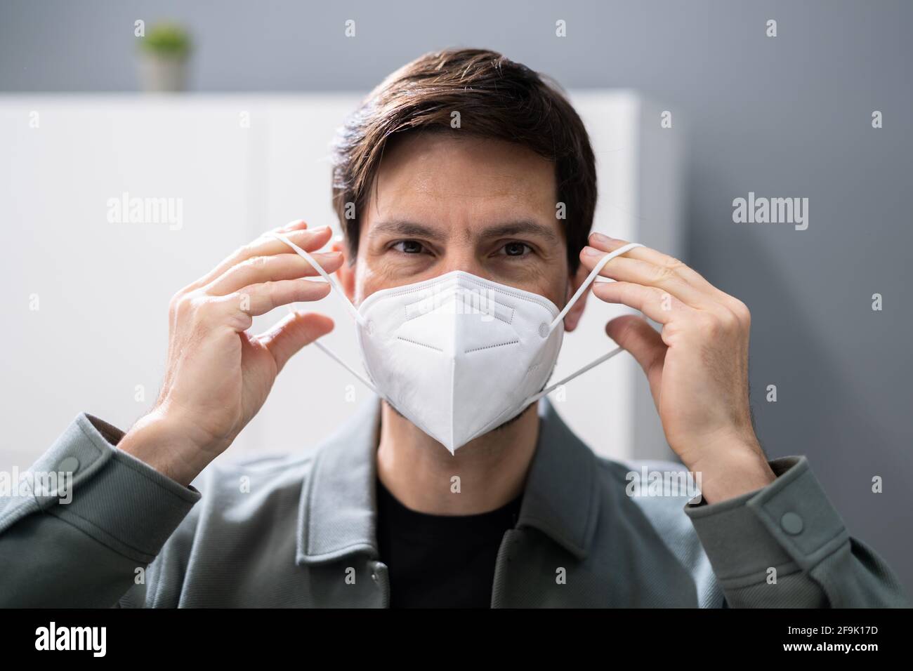 Wearing FFP2 Or KN95 Face Mask Respirator Stock Photo