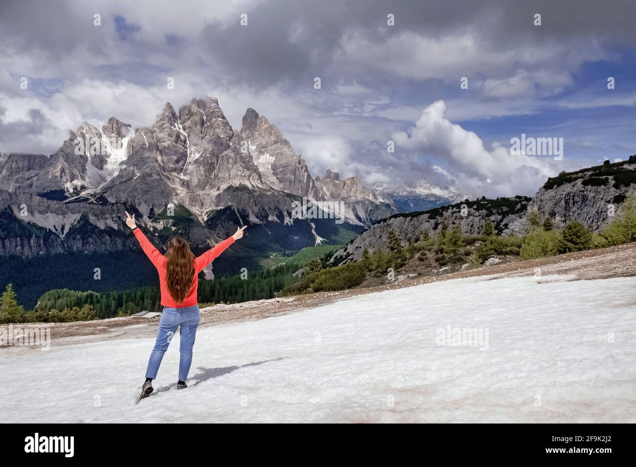 Woman traveller hiking in Dolomite Alps mountains. Stock Photo