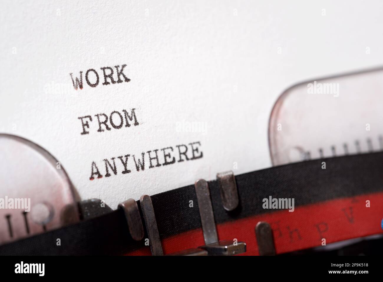 Work from anywhere phrase written with a typewriter. Stock Photo