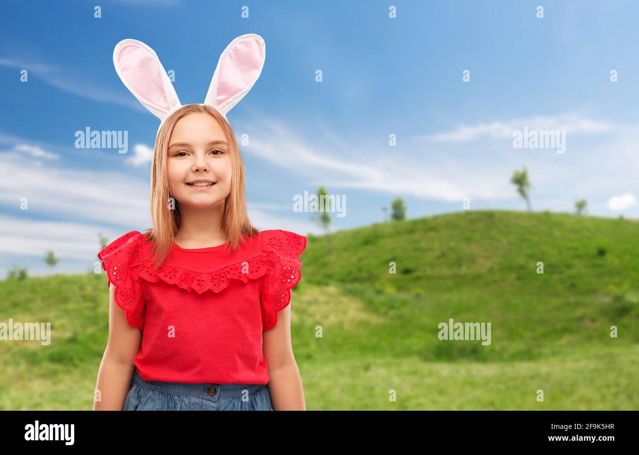 happy girl wearing easter bunny ears headband Stock Photo Alamy