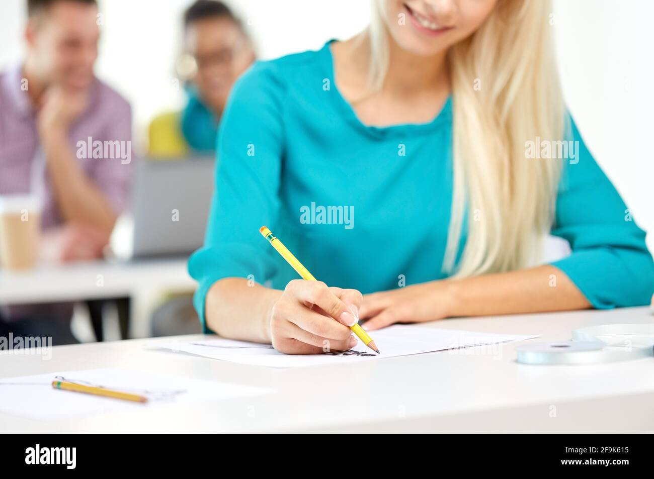 female fashion designer drawing sketch with pencil Stock Photo - Alamy