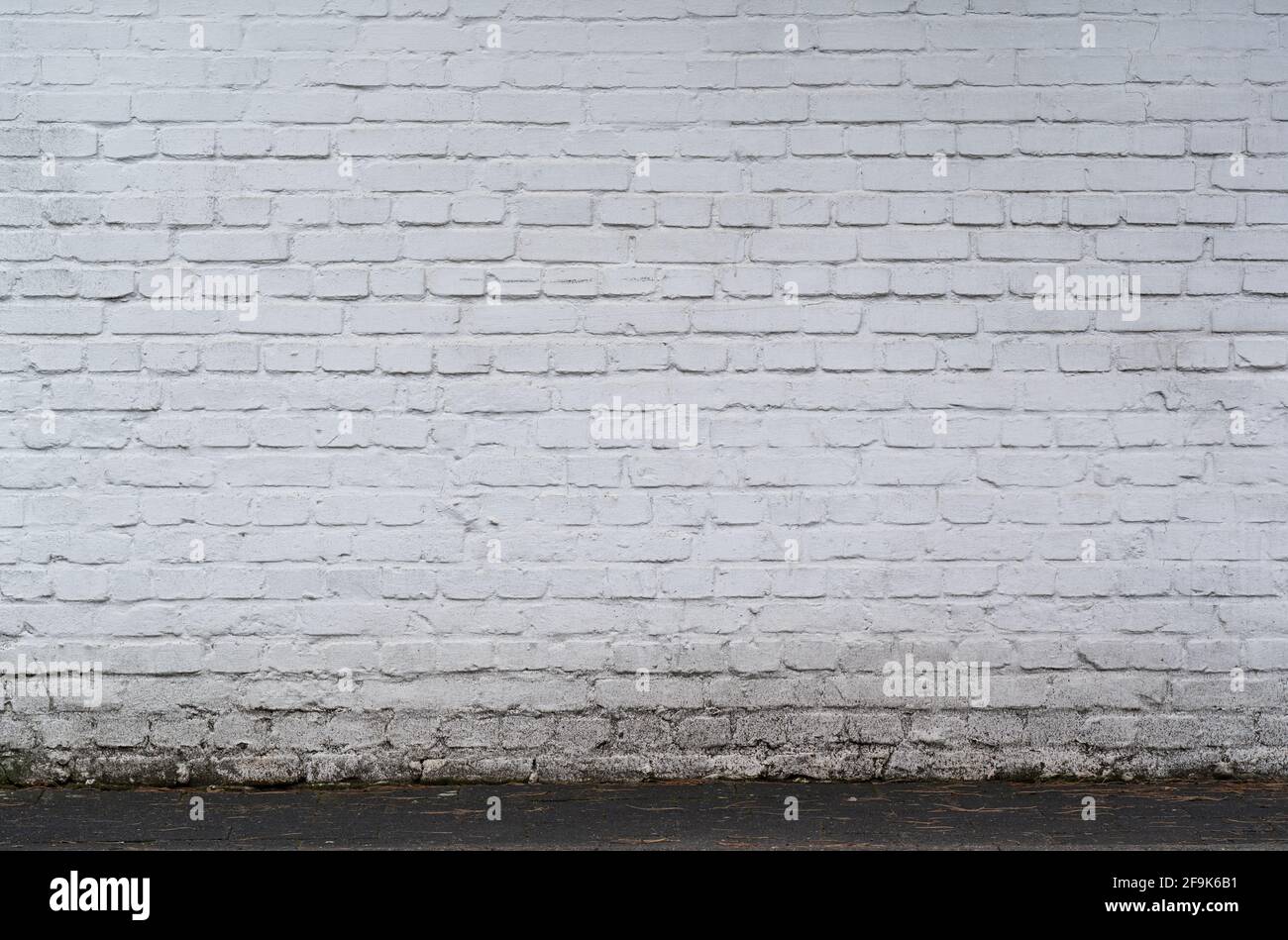 old and dirty white painted brick wall texture background with copy ...