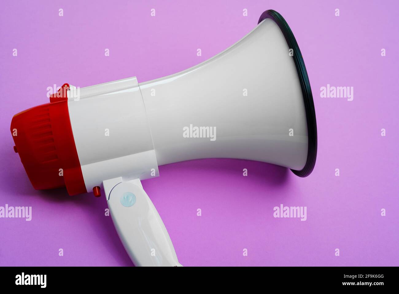 Electronic megaphone close up on purple background Stock Photo Alamy