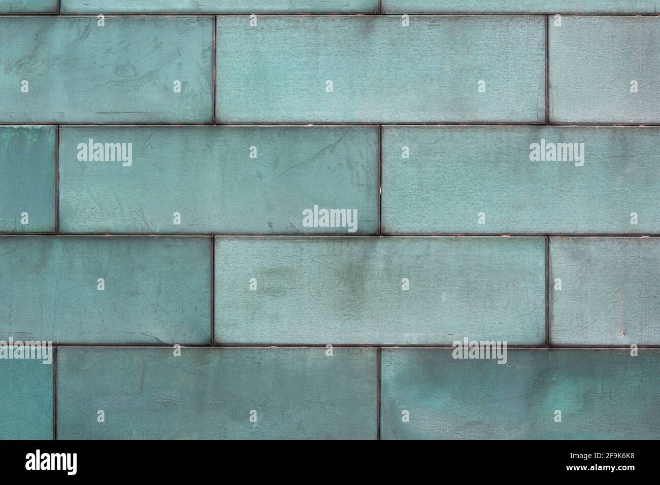 green tarnished copper background metal texture with copy space Stock