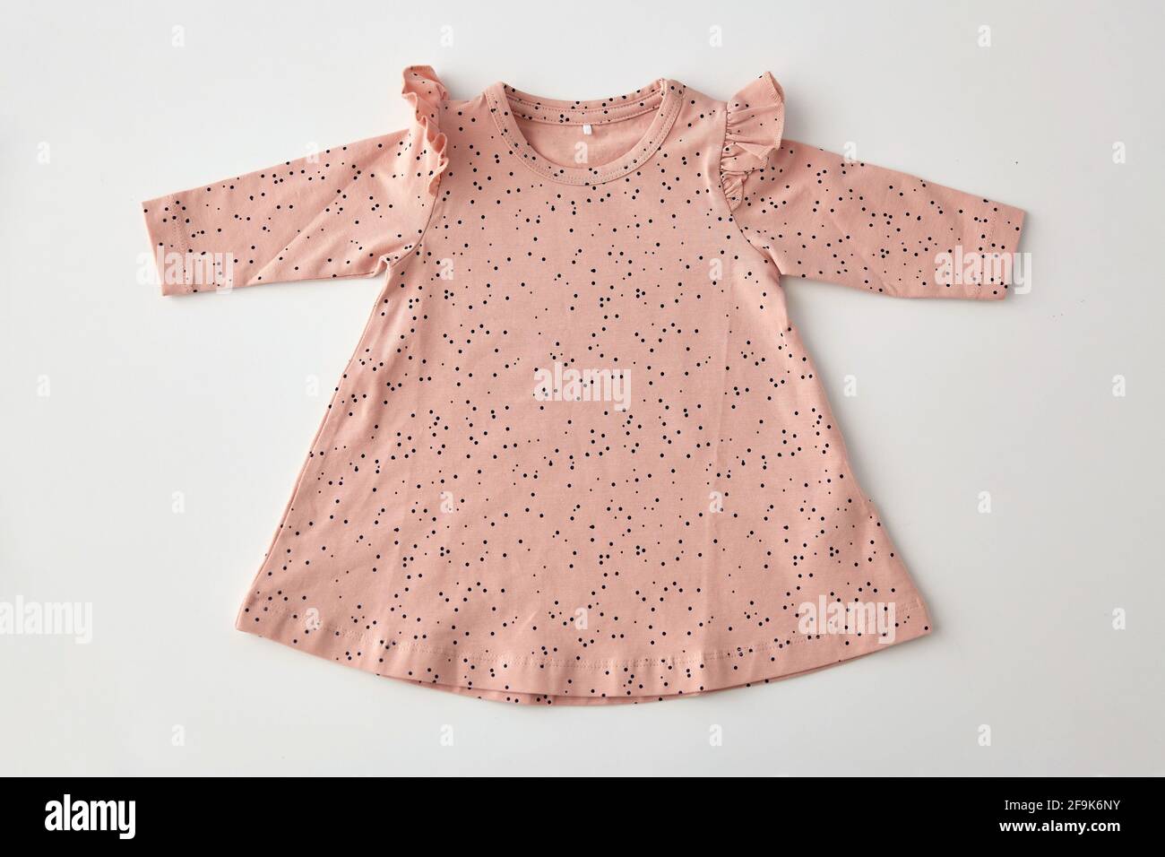pink dress for baby girl on white background Stock Photo - Alamy