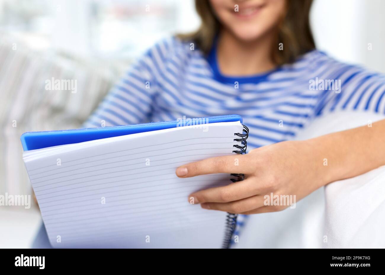 close up of student girl with exercise book Stock Photo - Alamy