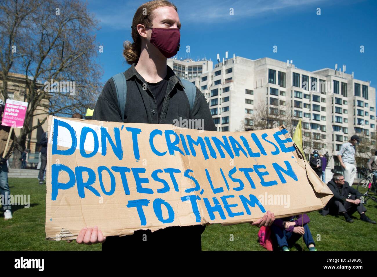 17.04.2021. Kill the Bill protest. Wellington Arch. A demonstrator holds a sign saying 'Don't criminalise protests, listen to them'. Stock Photo