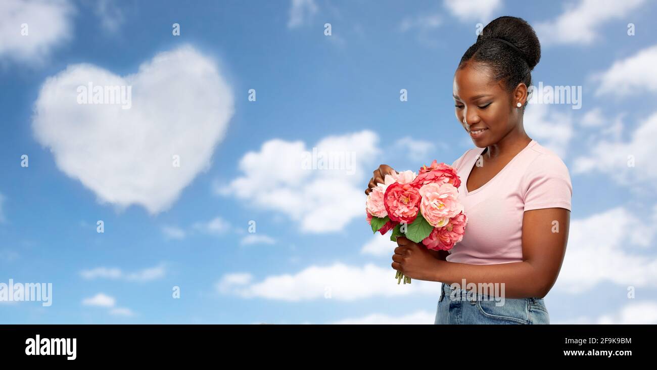 happy african american woman with bunch of flowers Stock Photo - Alamy